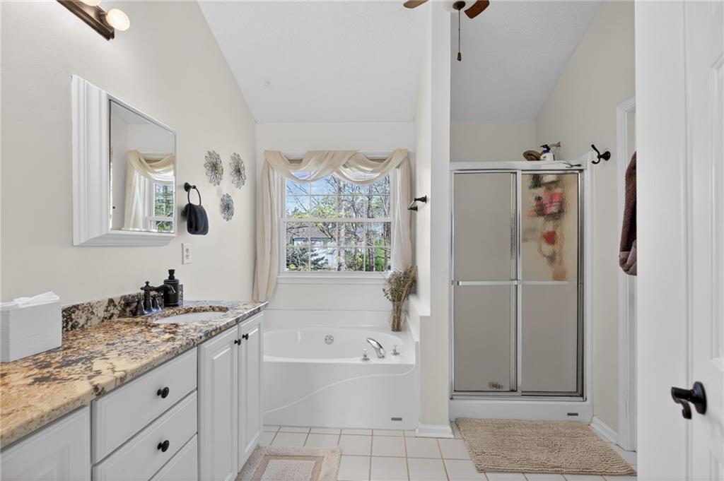 53 Crestview Drive Dallas, GA 30157 - Photo 21 of 46 a bathroom with a tub sink and mirror