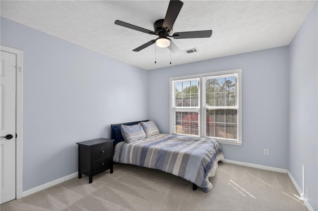 53 Crestview Drive Dallas, GA 30157 - Photo 23 of 46 a bedroom with a bed and window