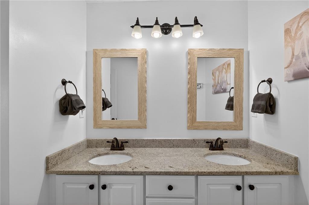 53 Crestview Drive Dallas, GA 30157 - Photo 26 of 46 a bathroom with a granite countertop sink and a mirror