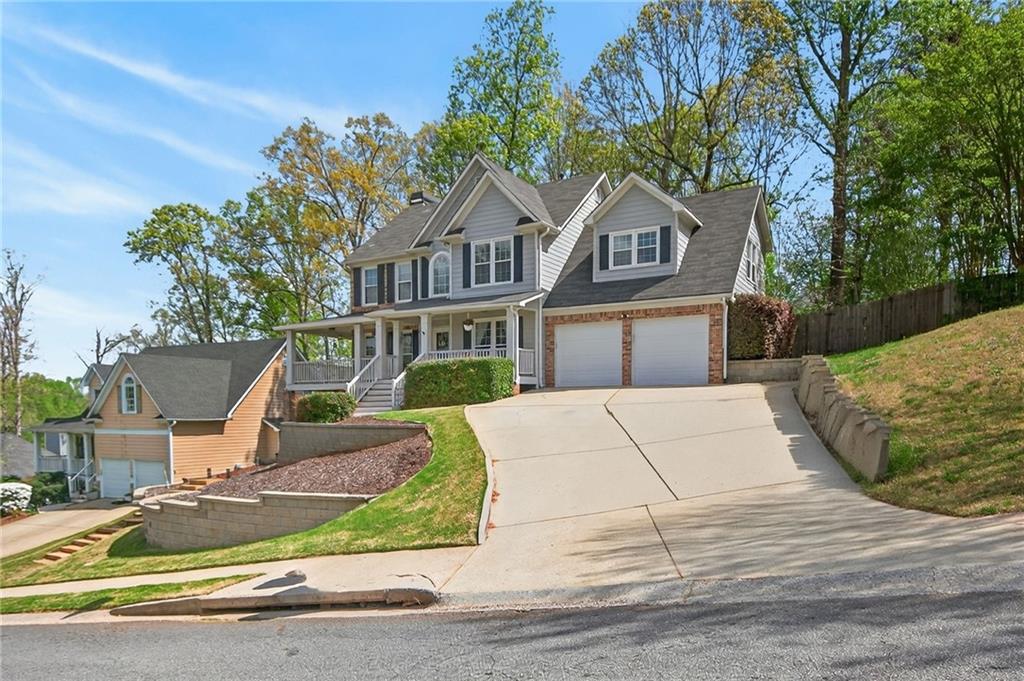 53 Crestview Drive Dallas, GA 30157 - Photo 4 of 46 a front view of a house with a garden