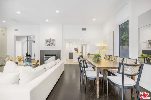 a view of a dining room with furniture and a fireplace