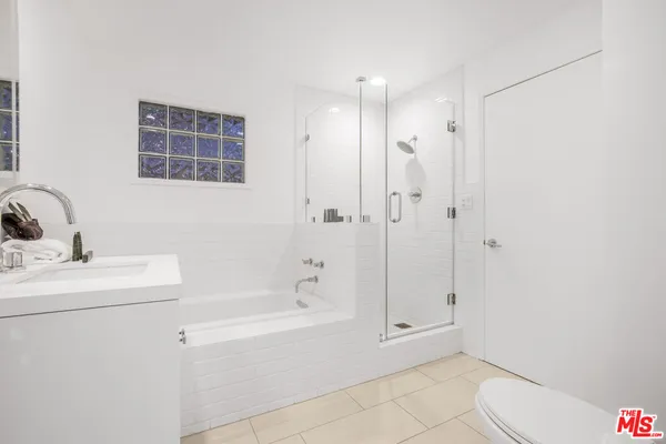 a bathroom with a bathtub sink and toilet