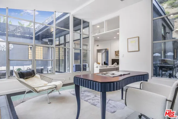 a living room with furniture and a table