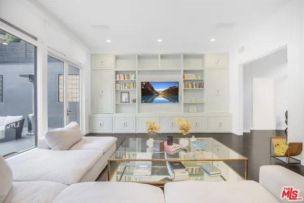 a living room with furniture and a table