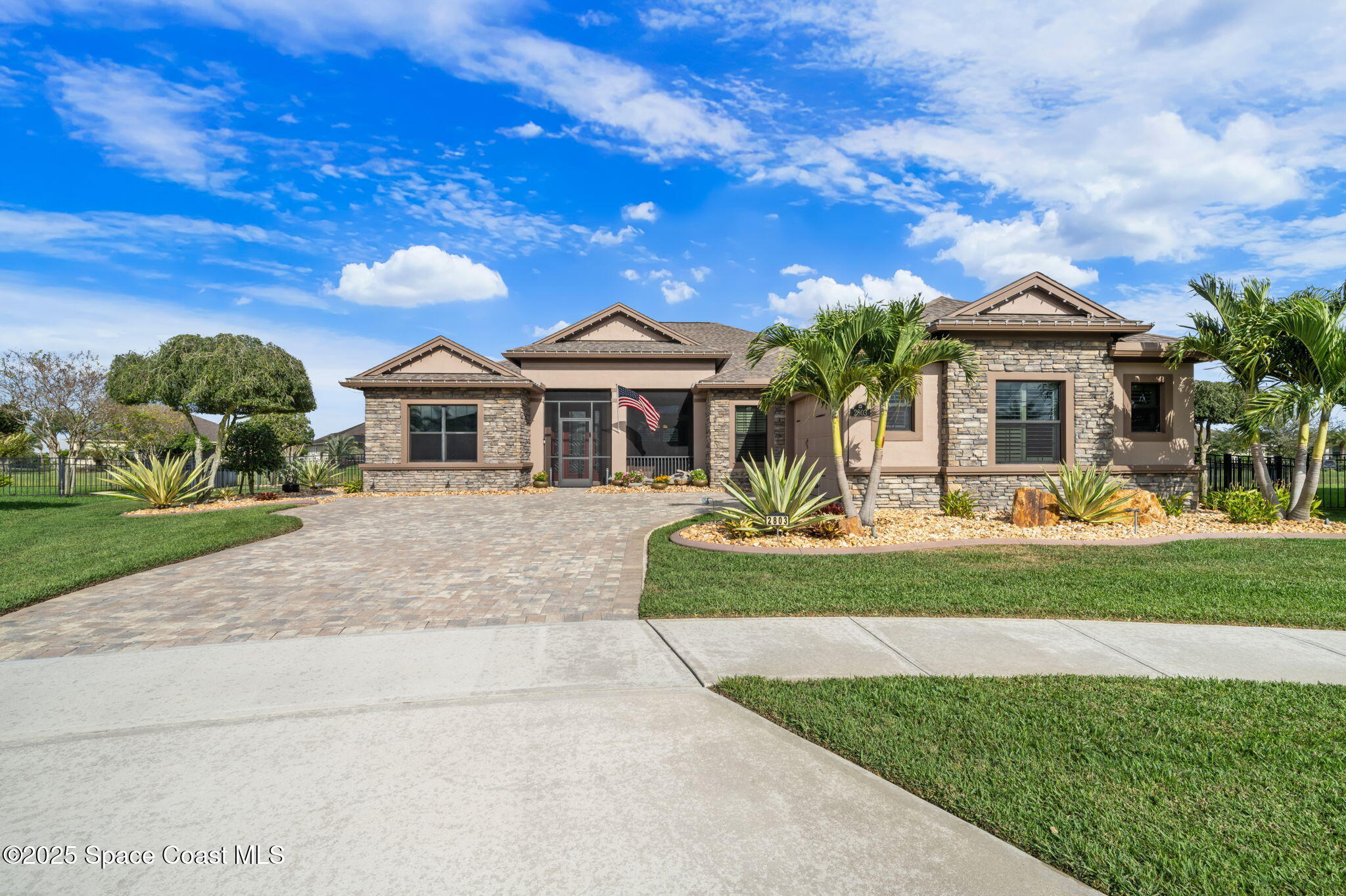 2803 Agilny Lane Melbourne, FL 32940 - Photo 11 of 65 a front view of a house with a yard