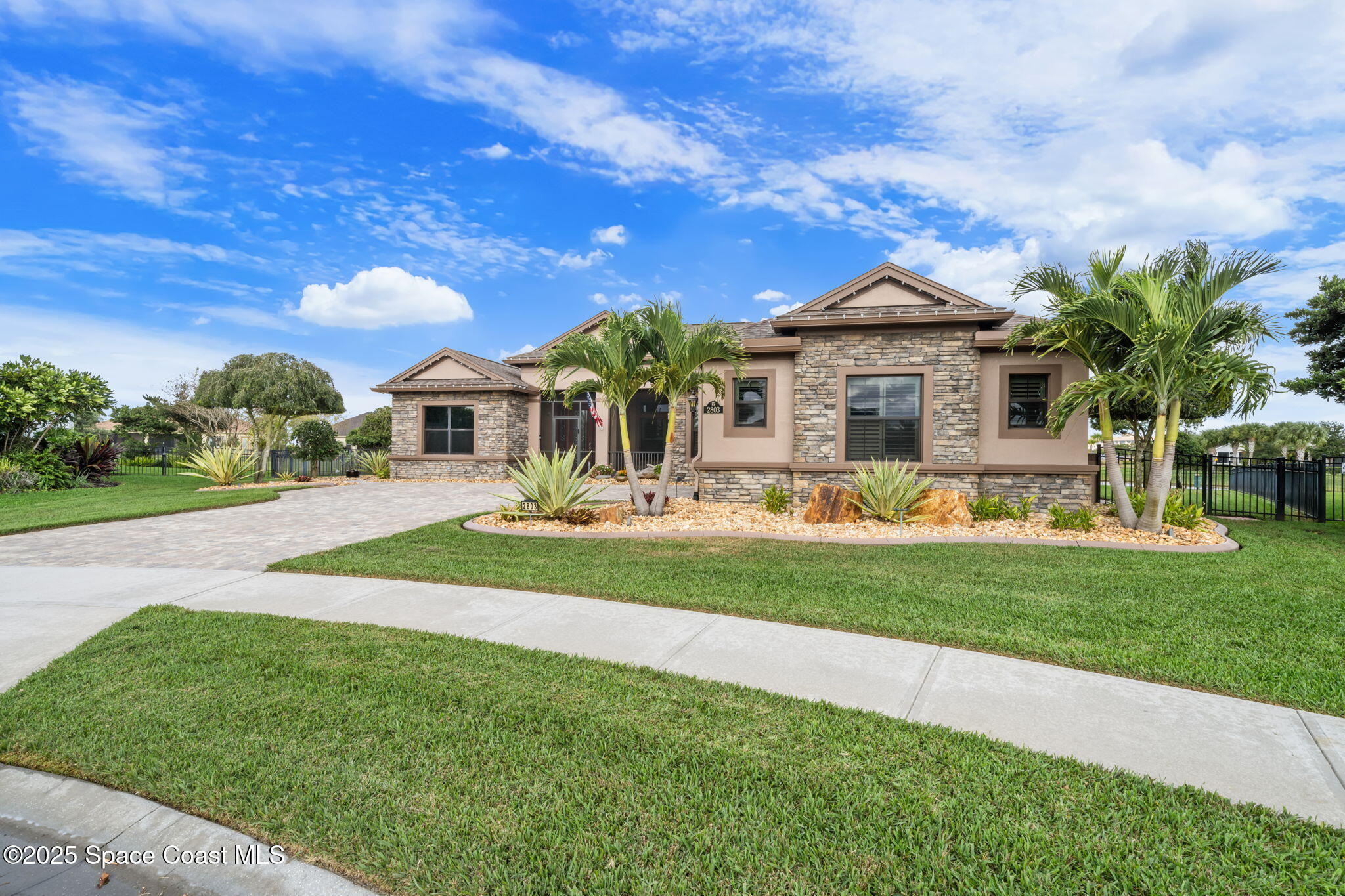2803 Agilny Lane Melbourne, FL 32940 - Photo 13 of 65 a front view of a house with garden and porch