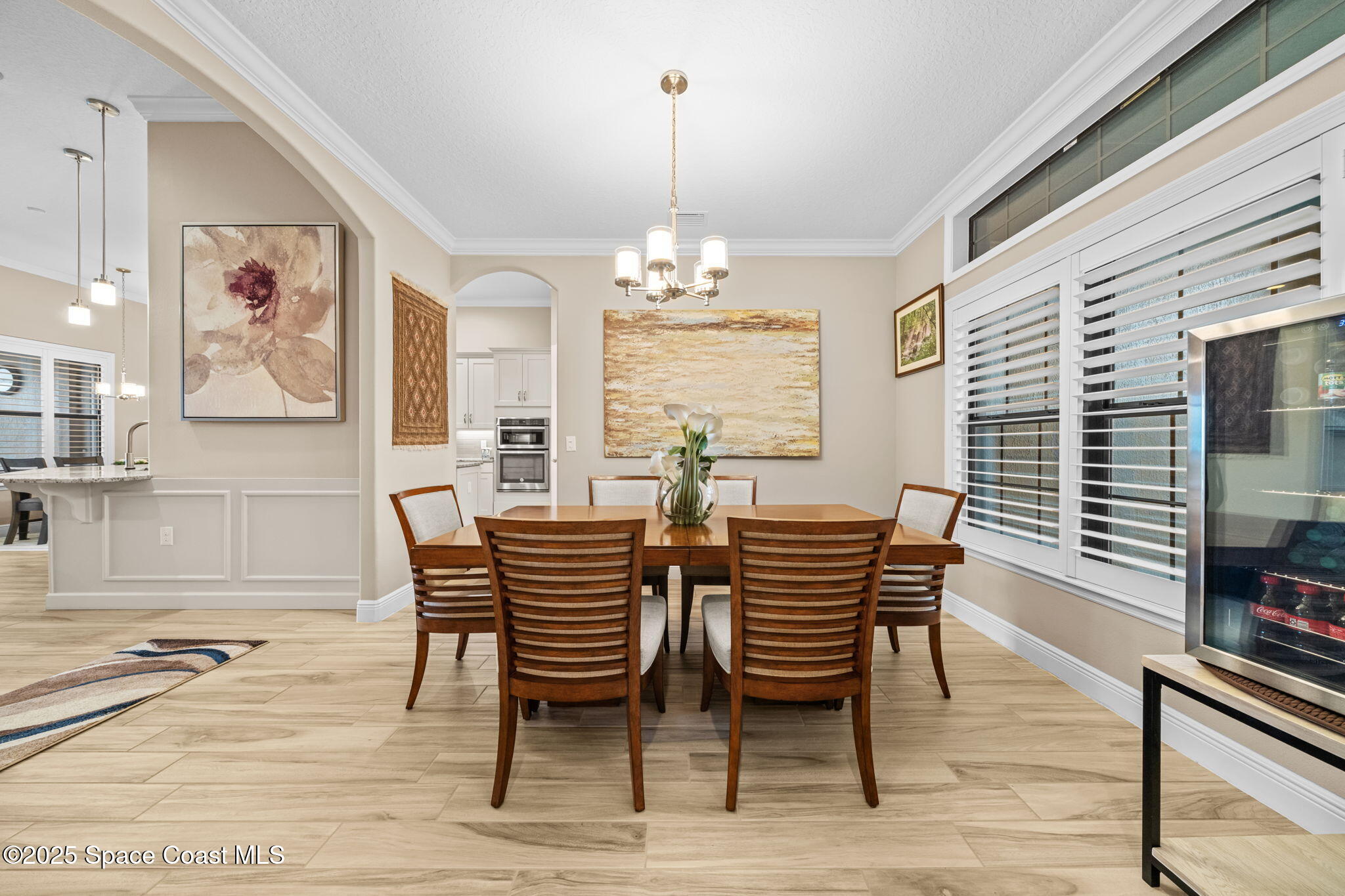 2803 Agilny Lane Melbourne, FL 32940 - Photo 16 of 65 a dining room with furniture and window