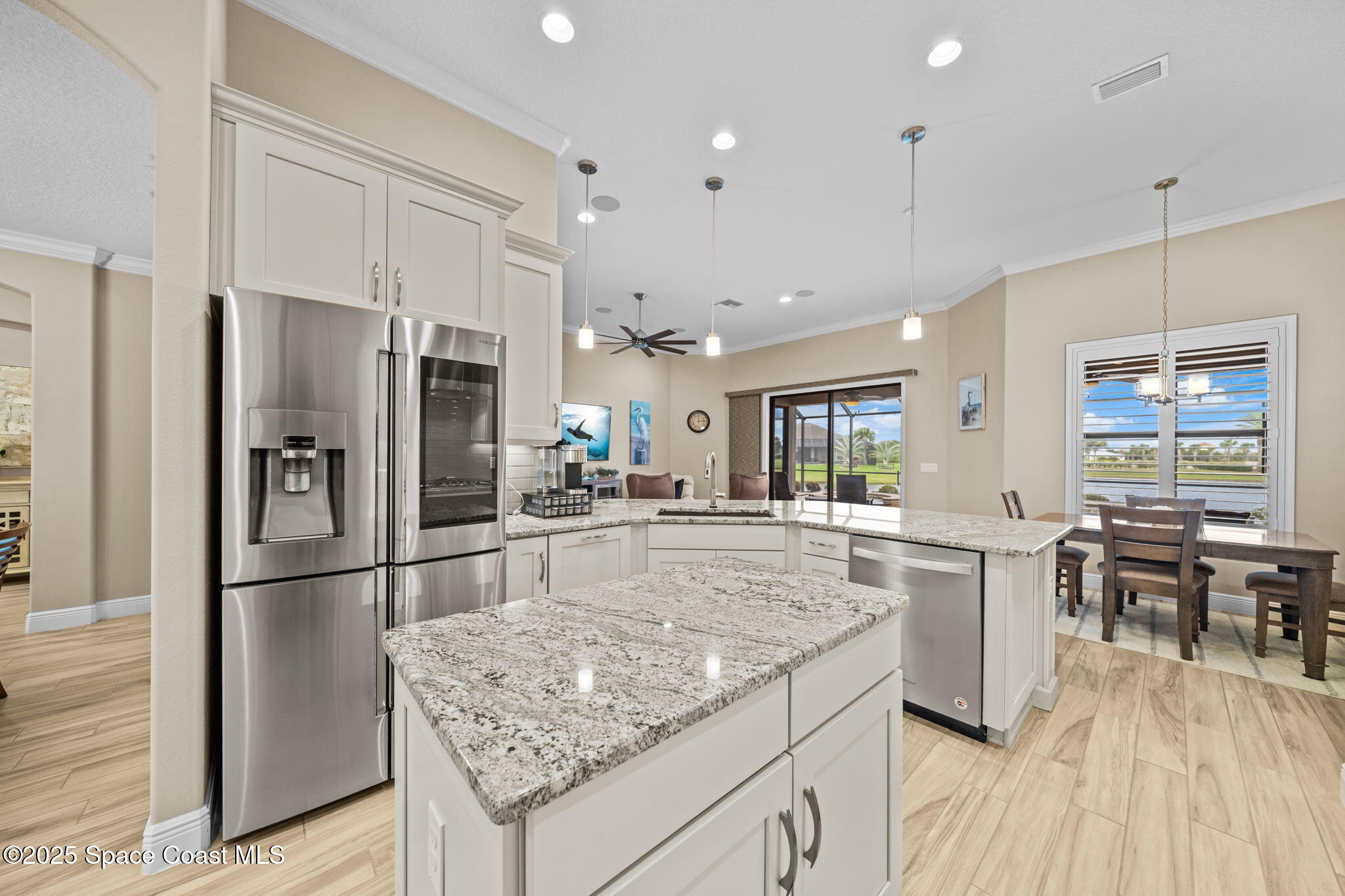 2803 Agilny Lane Melbourne, FL 32940 - Photo 25 of 65 a kitchen with stainless steel appliances granite countertop a refrigerator and a stove top oven