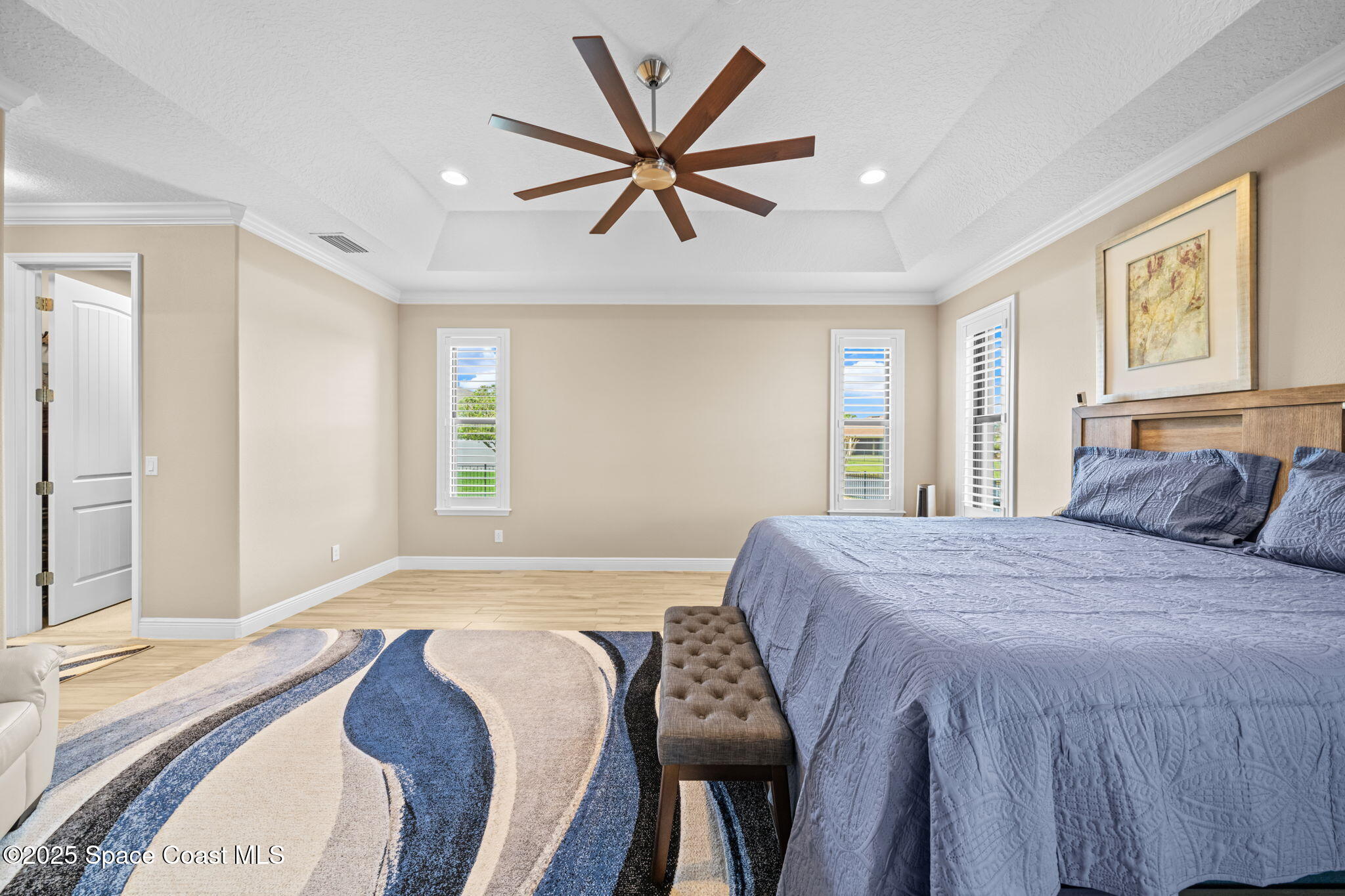 2803 Agilny Lane Melbourne, FL 32940 - Photo 30 of 65 a bedroom with a bed and window