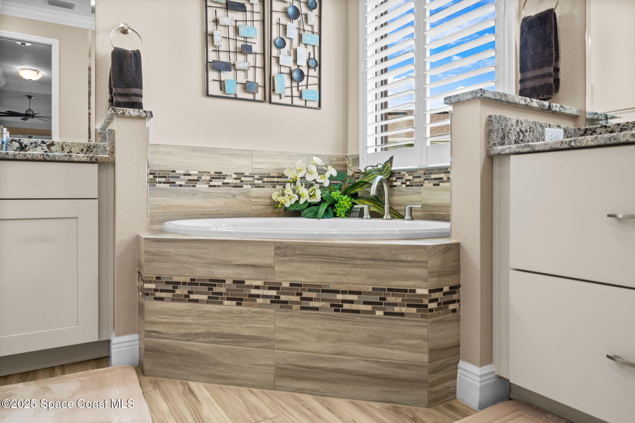 2803 Agilny Lane Melbourne, FL 32940 - Photo 32 of 65 a view of a living room with a bed furniture and a fireplace