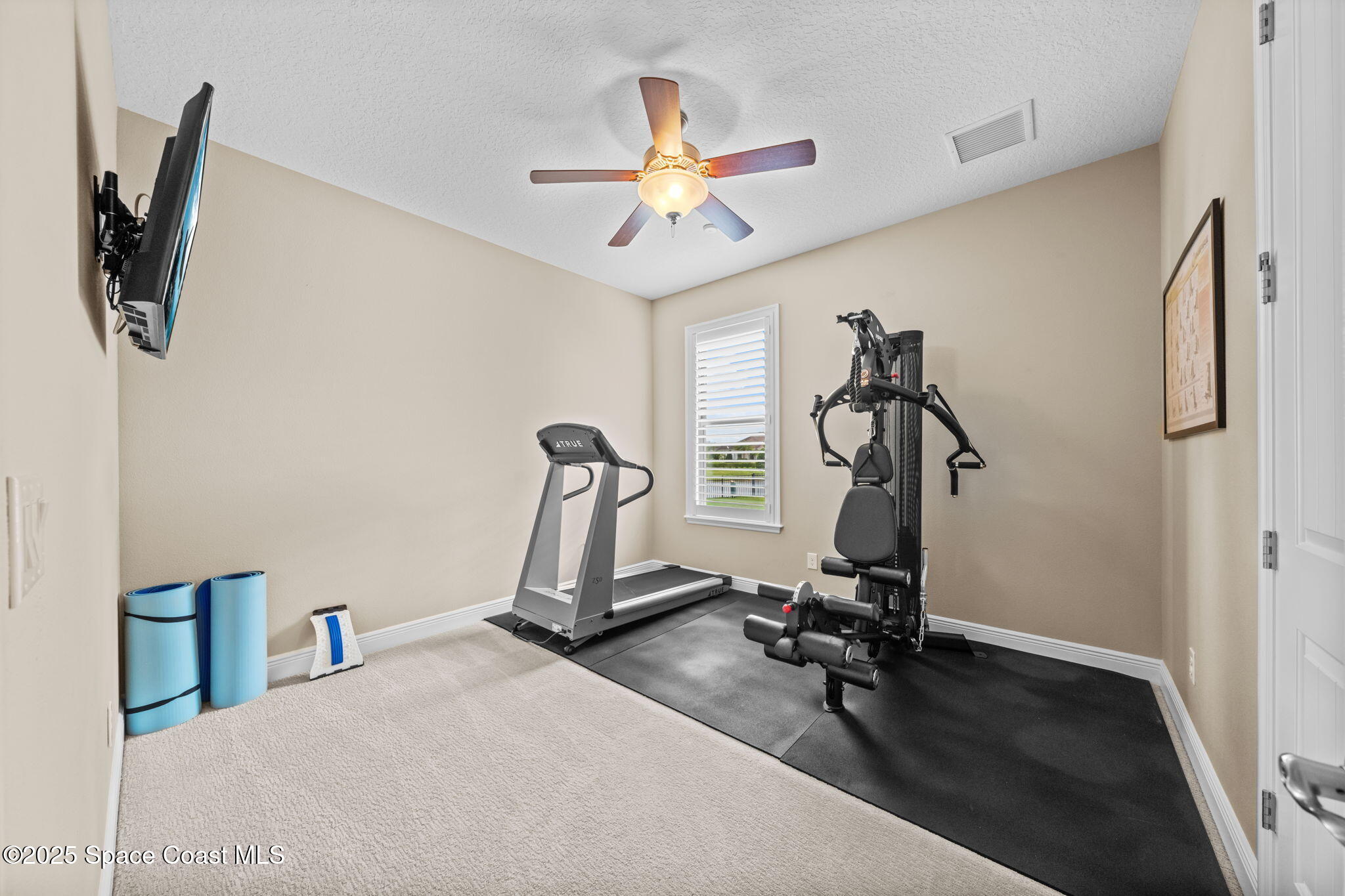 2803 Agilny Lane Melbourne, FL 32940 - Photo 43 of 65 a view of a room with gym equipment