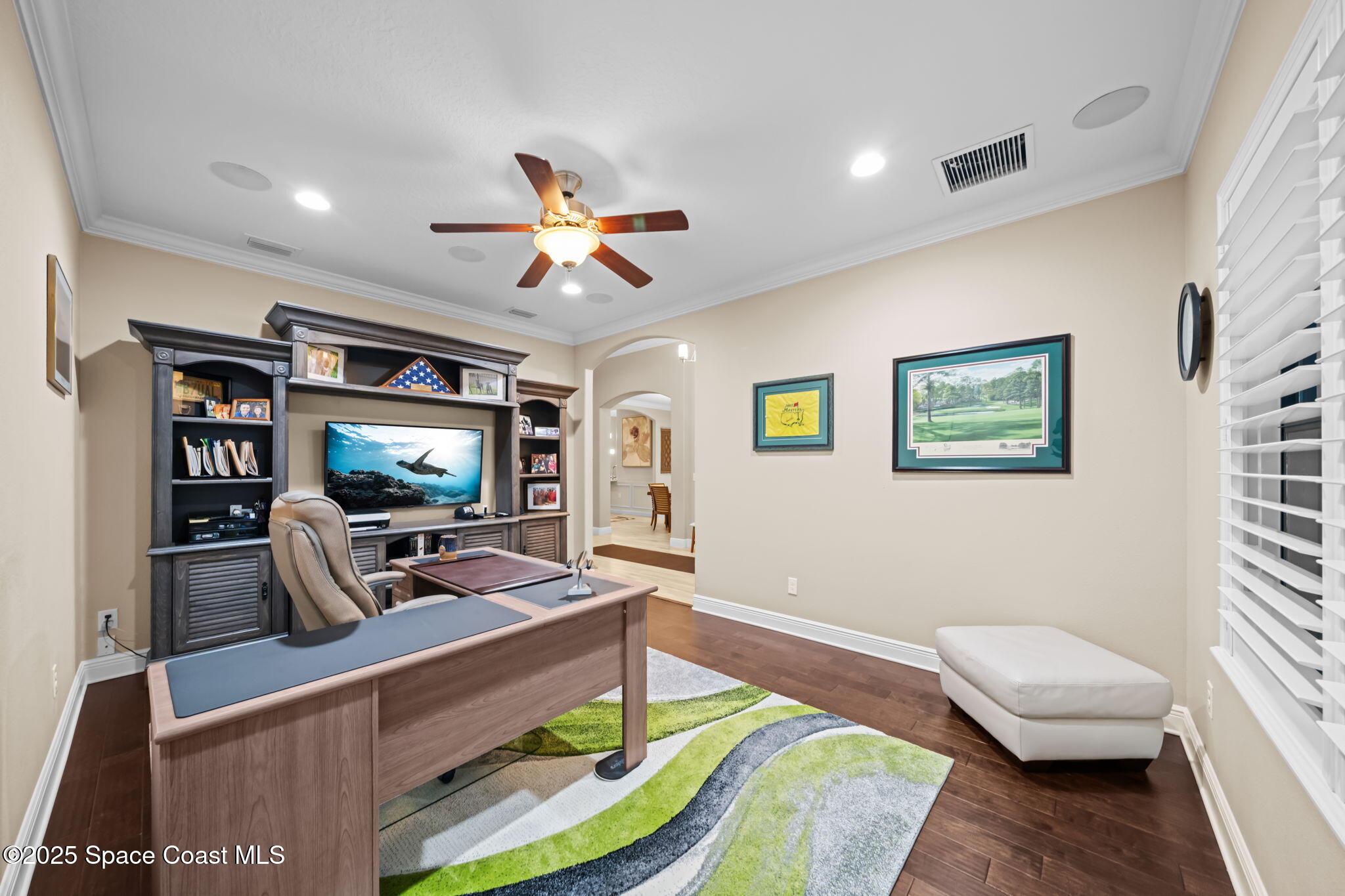 2803 Agilny Lane Melbourne, FL 32940 - Photo 46 of 65 a living room with furniture and a flat screen tv