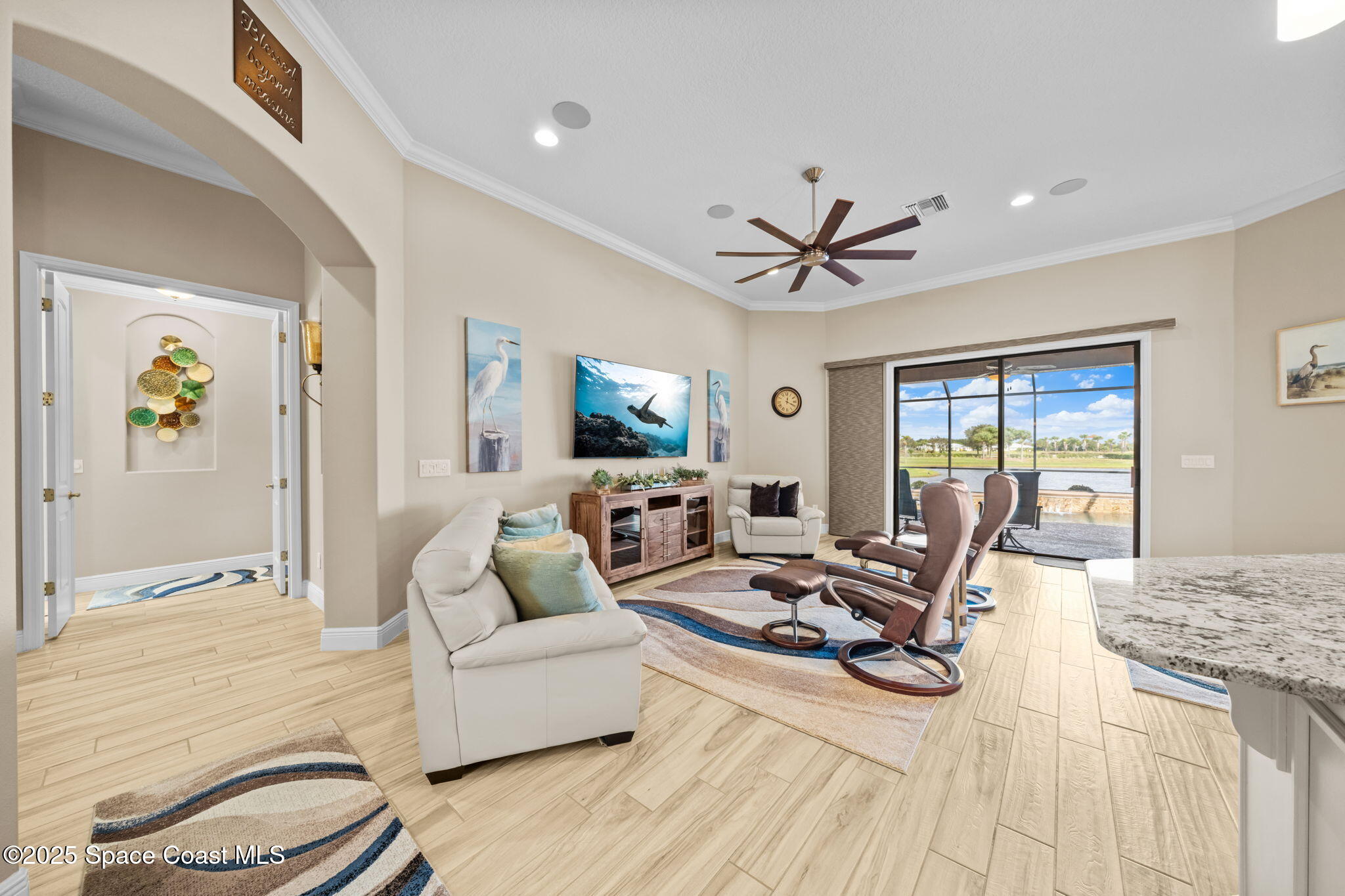 2803 Agilny Lane Melbourne, FL 32940 - Photo 5 of 65 a living room with furniture and a large window