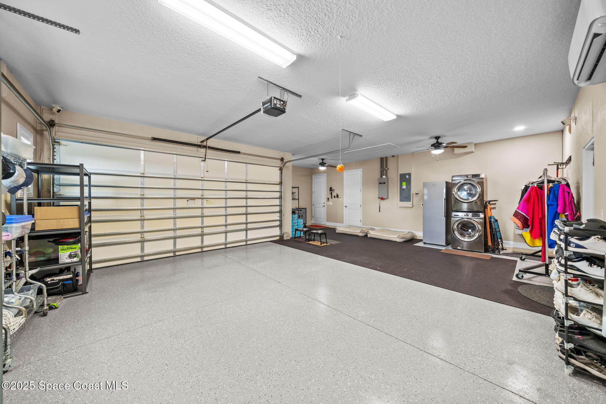 2803 Agilny Lane Melbourne, FL 32940 - Photo 53 of 65 a view of a garage with storage