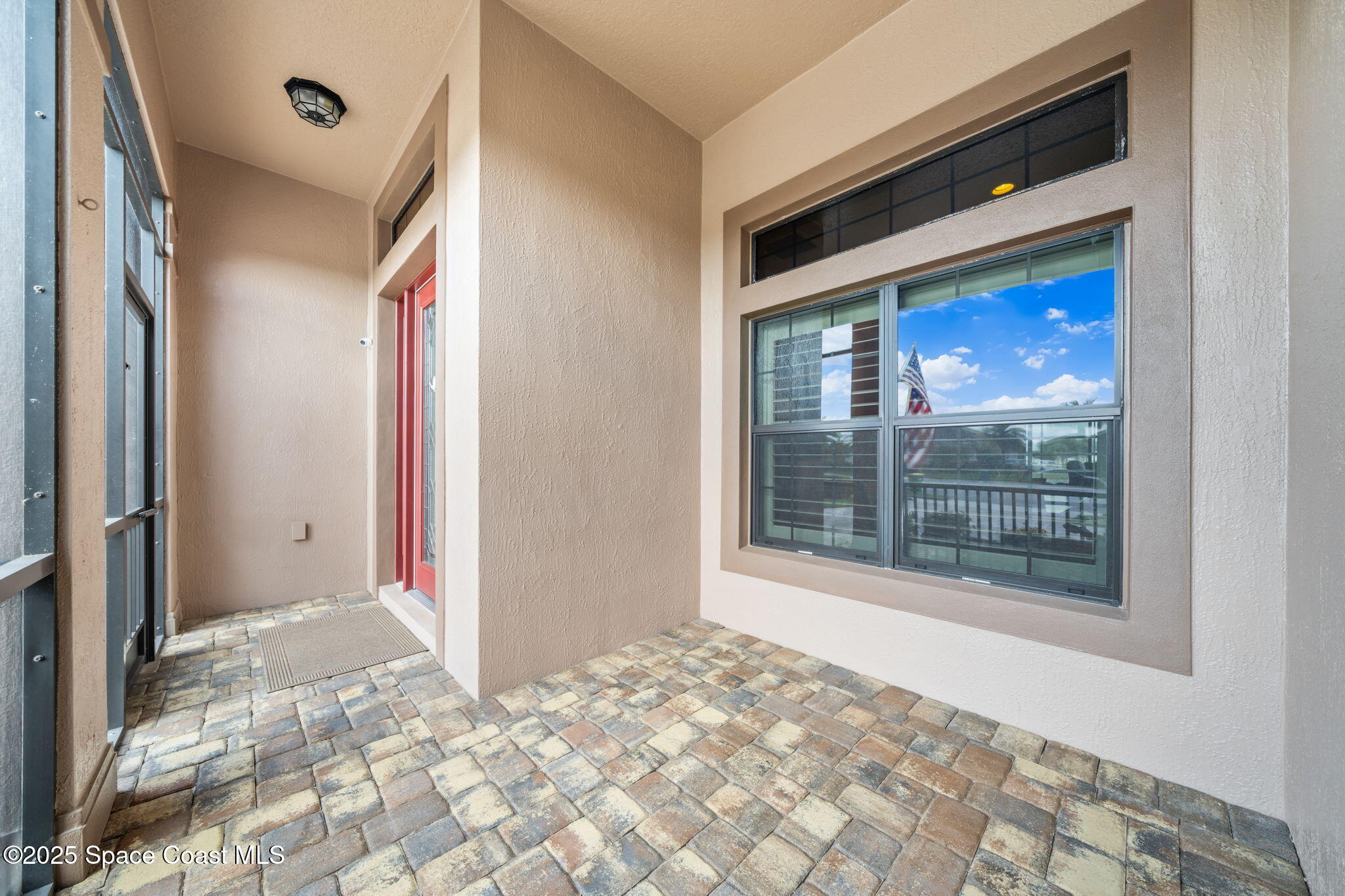 2803 Agilny Lane Melbourne, FL 32940 - Photo 54 of 65 a view of a big room with wooden floor and windows