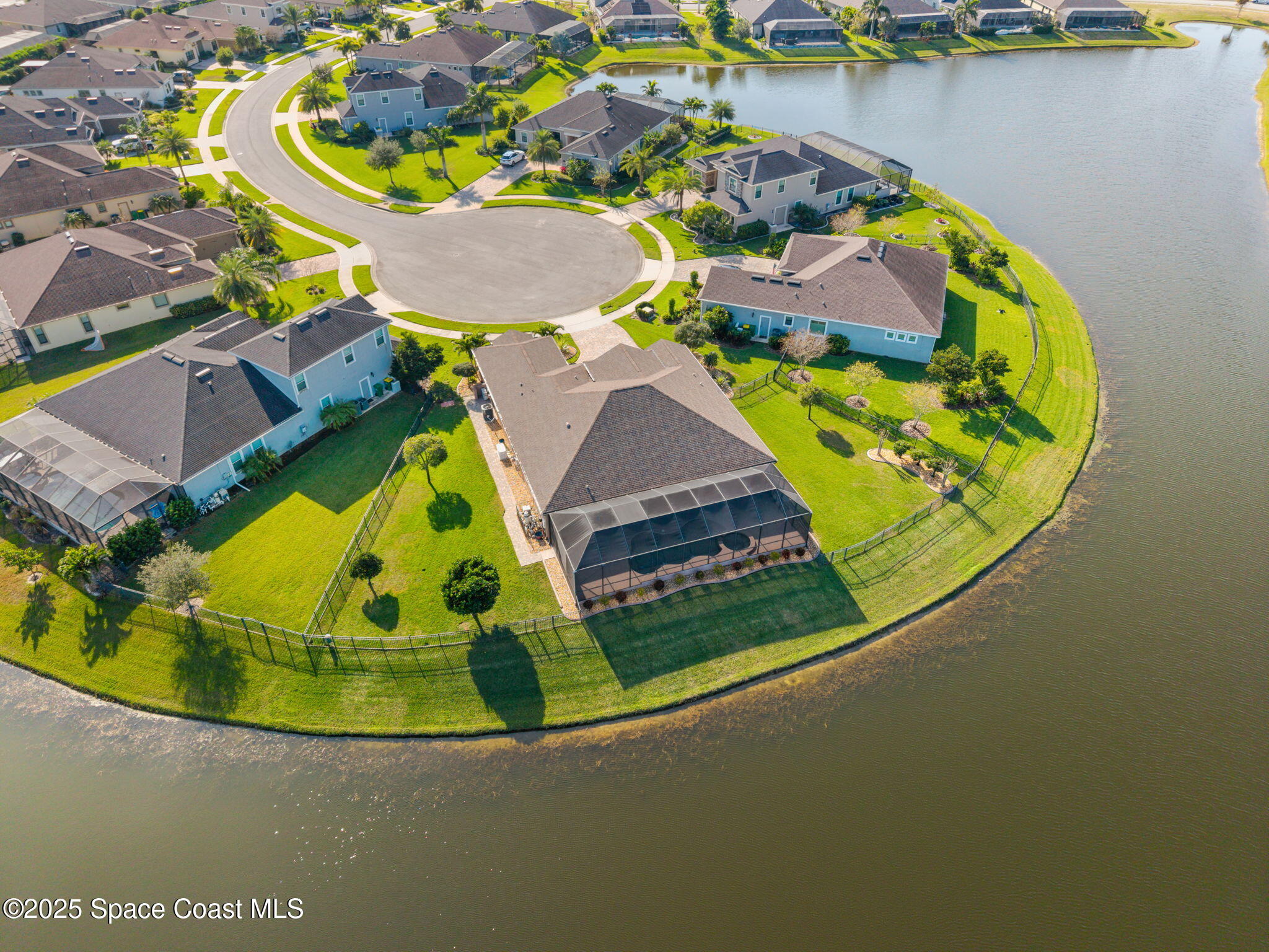 2803 Agilny Lane Melbourne, FL 32940 - Photo 56 of 65 an aerial view of a house with a swimming pool