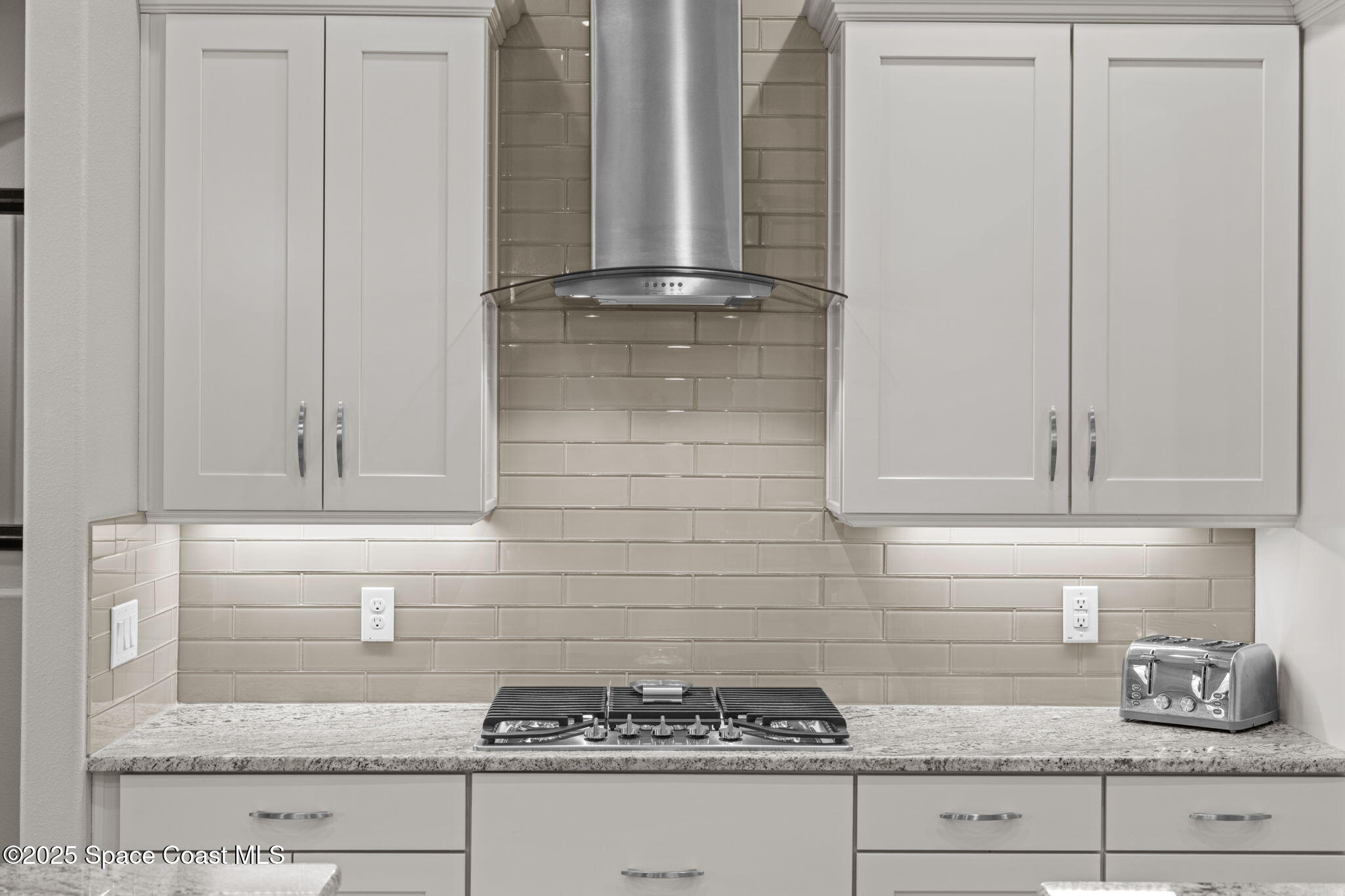 2803 Agilny Lane Melbourne, FL 32940 - Photo 60 of 65 a kitchen with granite countertop white cabinets and white appliances