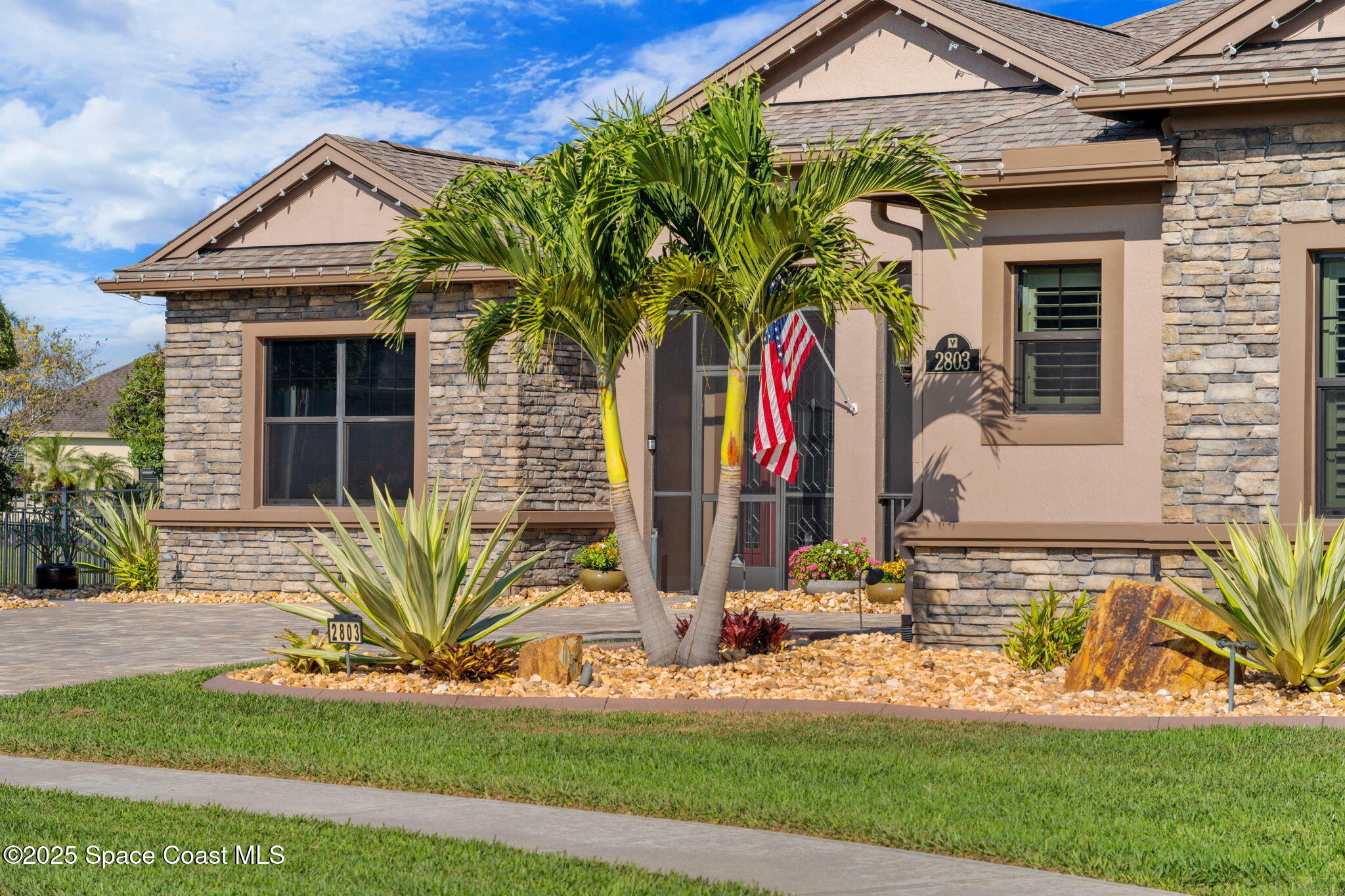 2803 Agilny Lane Melbourne, FL 32940 - Photo 63 of 65 a front view of a house with garden