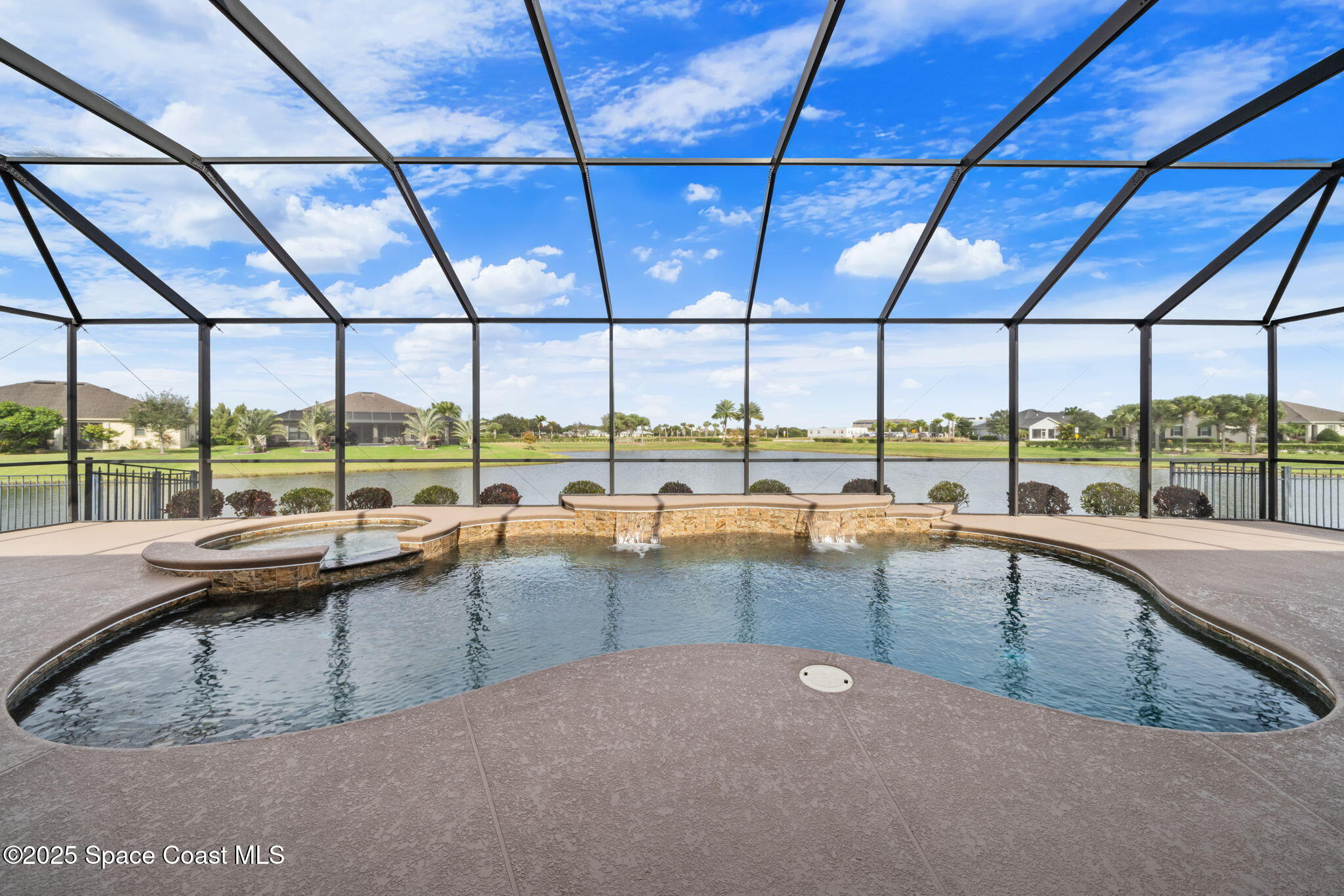 2803 Agilny Lane Melbourne, FL 32940 - Photo 7 of 65 a view of a swimming pool with outdoor seating