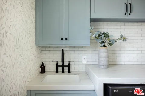 a bedroom with a large bed and a large window