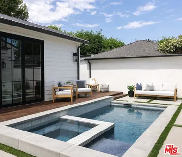 a view of kitchen with a stove and a microwave