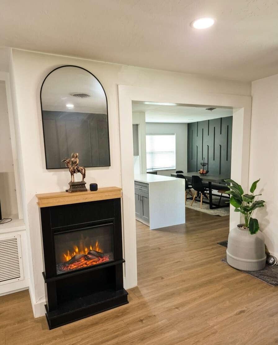 1773 Ocala Road North Palm Beach, FL 33408 - Photo 20 of 47 a living room with furniture and a fireplace or wooden floor