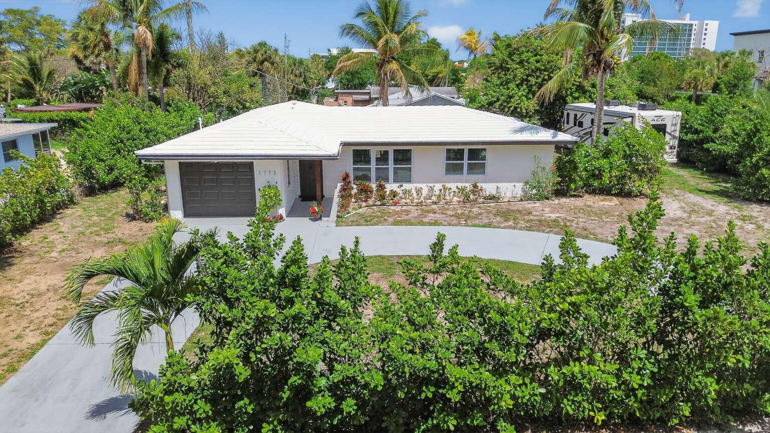 1773 Ocala Road North Palm Beach, FL 33408 - Photo 3 of 47 an aerial view of a house with yard patio and swimming pool
