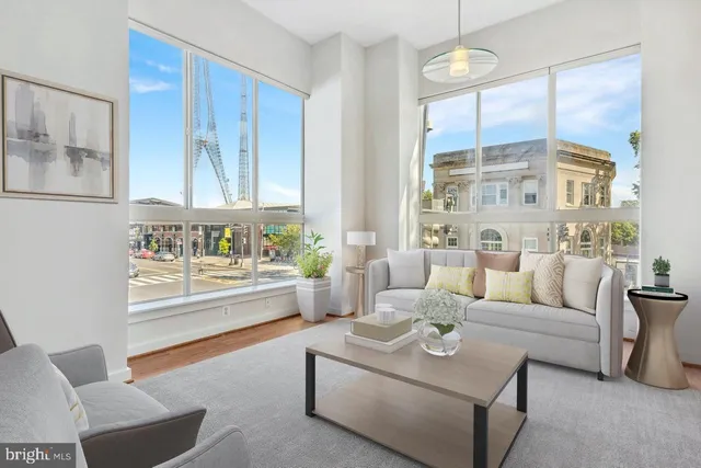 a living room with furniture and a large window