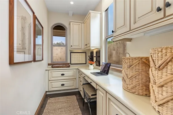 a kitchen with stainless steel appliances granite countertop a sink and cabinets
