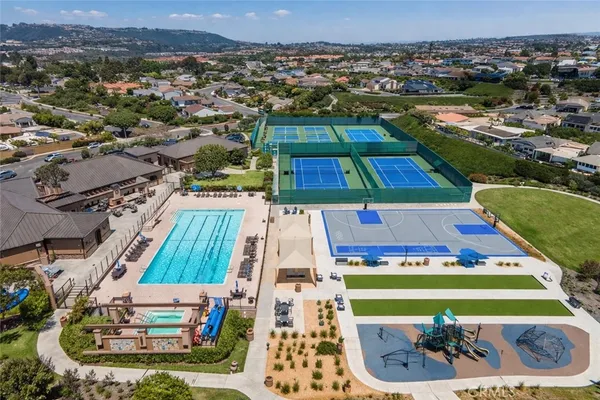 an aerial view of a house with a swimming pool