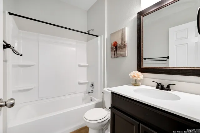 a bathroom with a sink a toilet and a bathtub