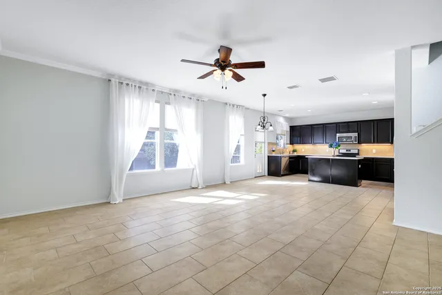 a view of a kitchen with a sink and a window