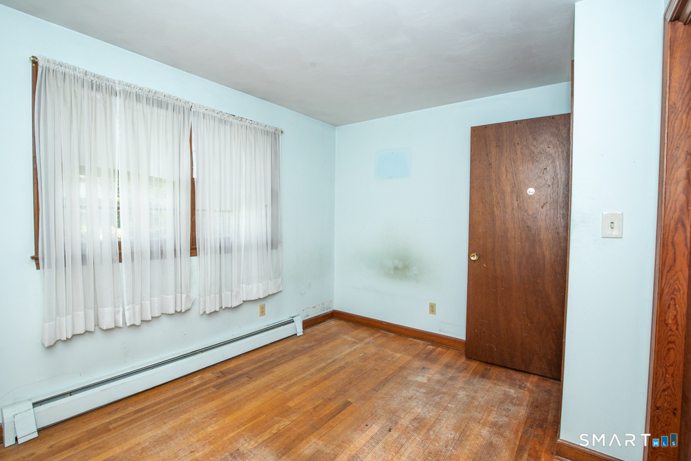 64 Somer Drive Meriden, CT 06451 - Photo 19 of 28 a view of empty room with wooden floor