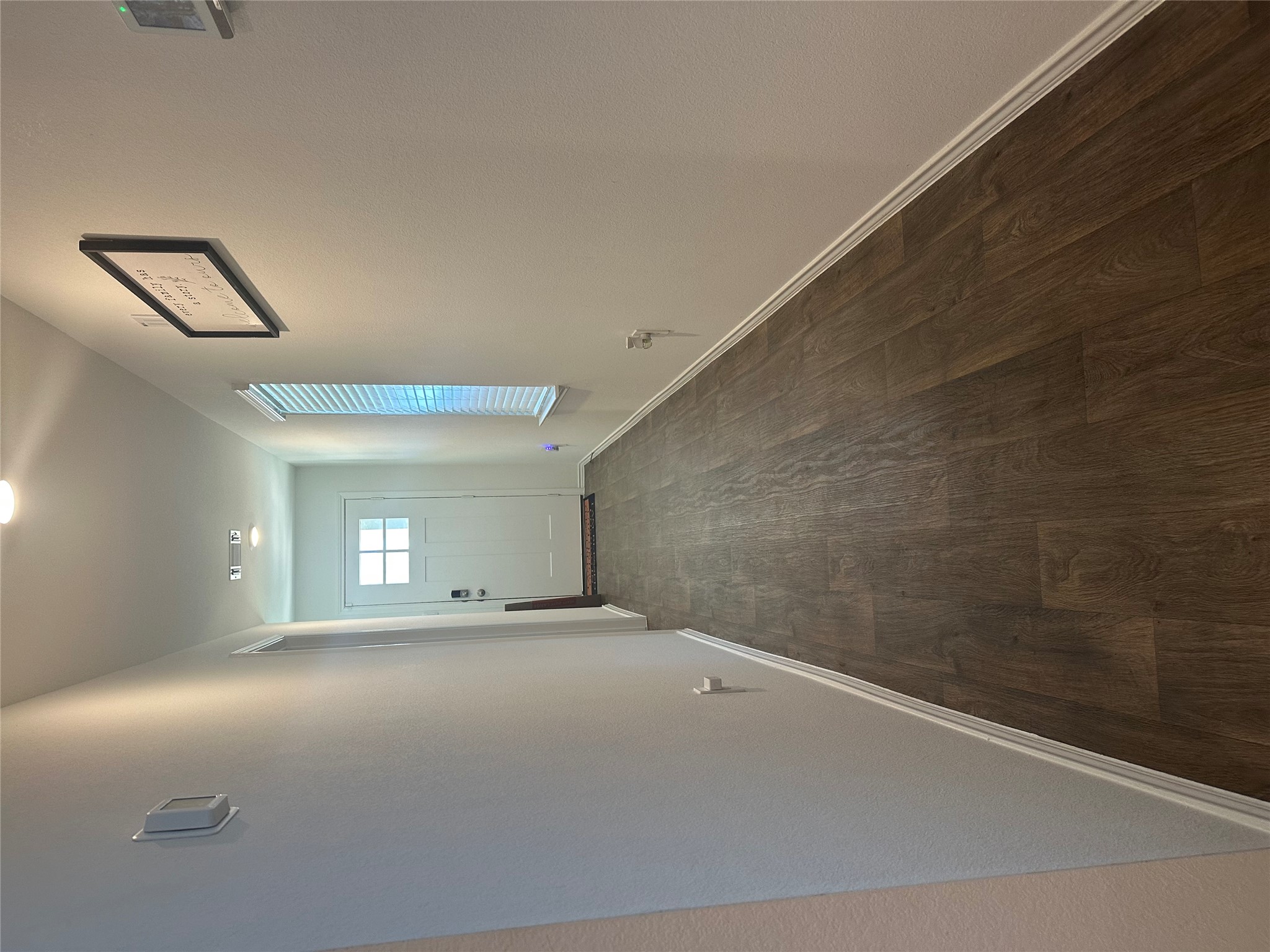 519 Sandringham Loop Kyle, TX 78640 - Photo 12 of 26 Entryway featuring wood finished floors and baseboards