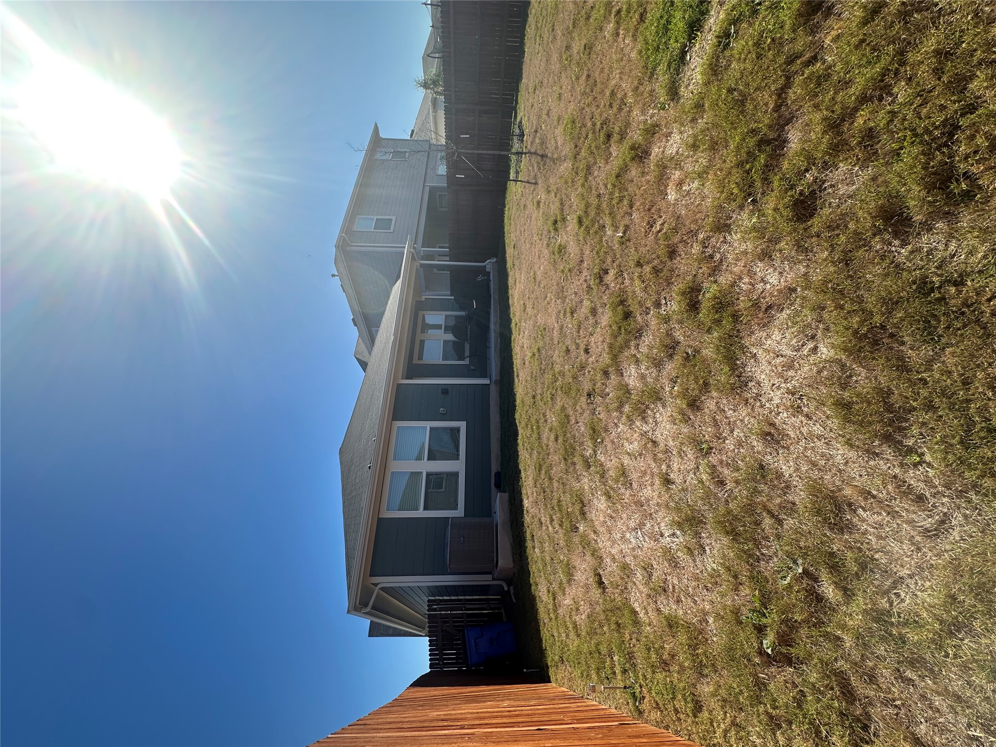 519 Sandringham Loop Kyle, TX 78640 - Photo 17 of 26 Rear view of house featuring a fenced backyard and a patio area