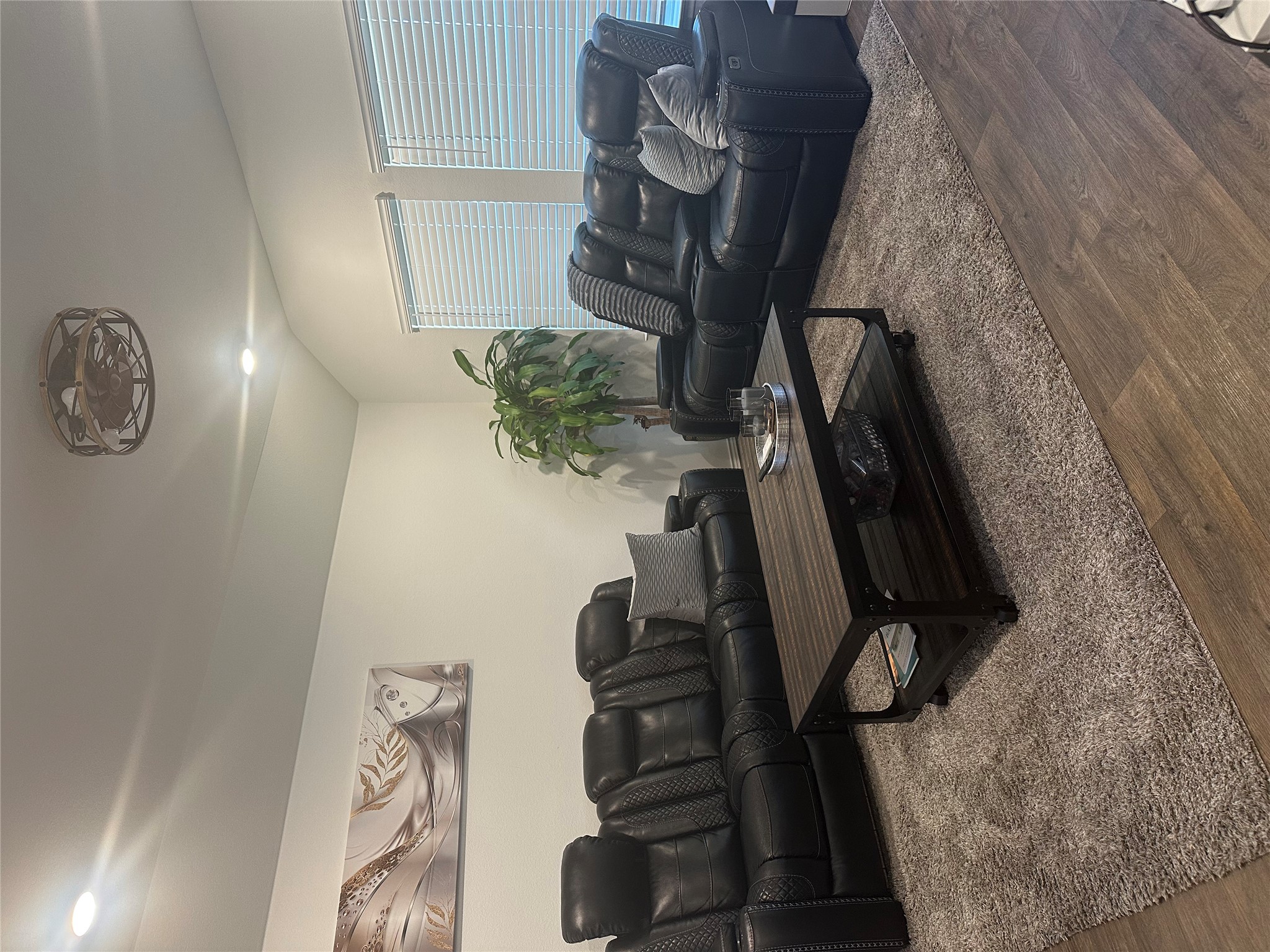 519 Sandringham Loop Kyle, TX 78640 - Photo 2 of 26 Living area with wood finished floors, lofted ceiling, and recessed lighting