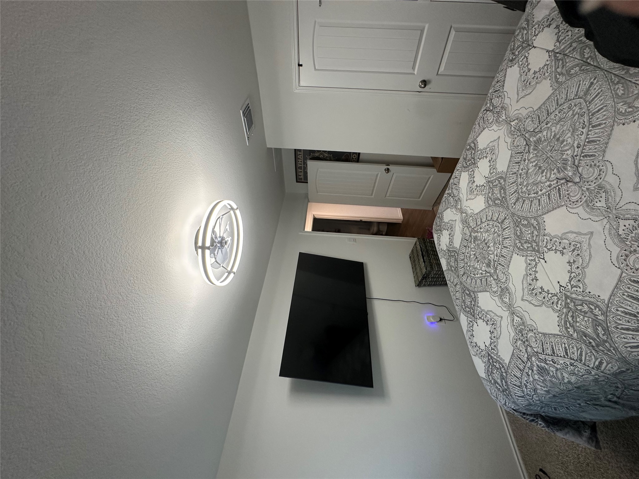 519 Sandringham Loop Kyle, TX 78640 - Photo 21 of 26 Bedroom featuring a textured ceiling, a closet, and carpet floors