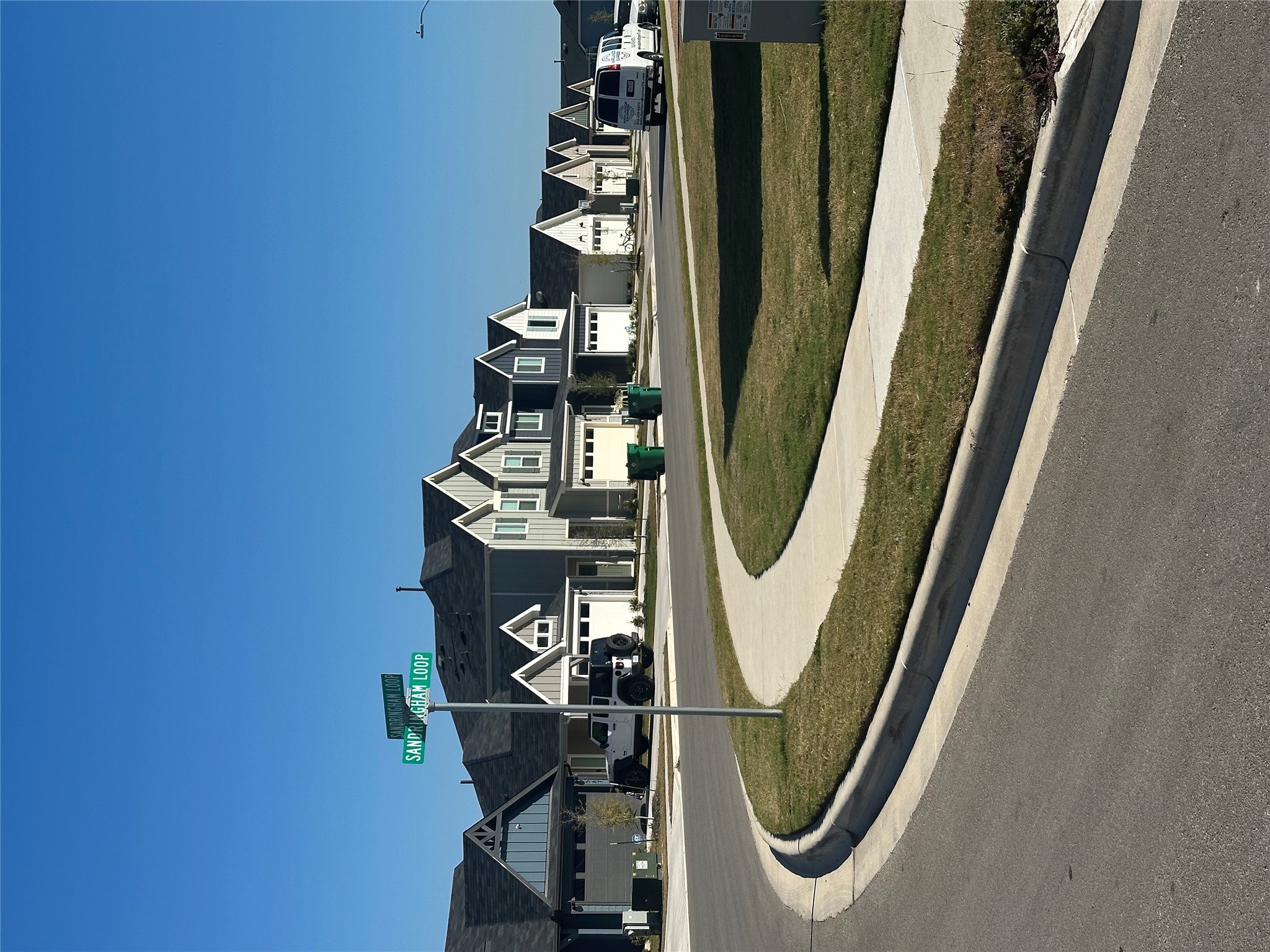 519 Sandringham Loop Kyle, TX 78640 - Photo 24 of 26 View of asphalt road with sidewalks, curbs, and a residential view