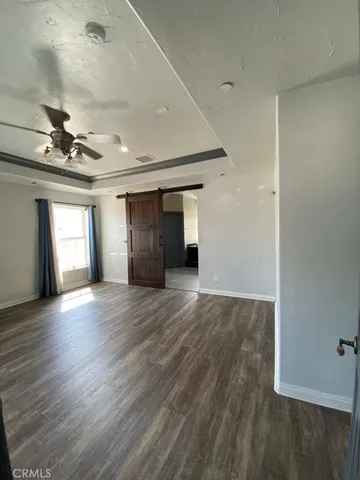 a white toilet sitting next to a window
