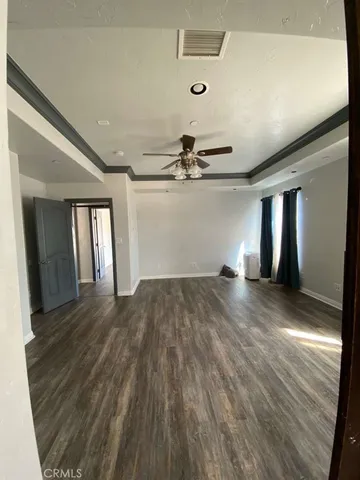 a bedroom with a bed and a sink