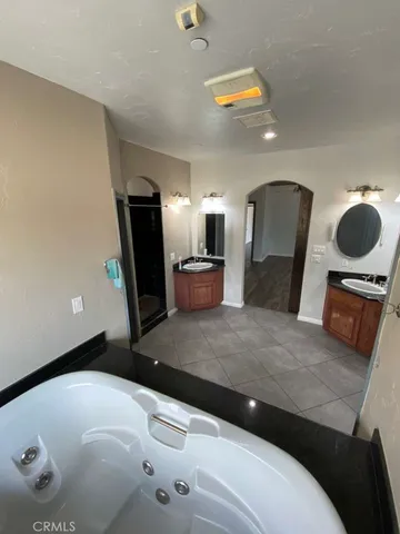 a view of kitchen with windows and refrigerator