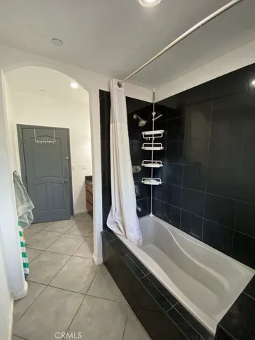 wooden floor in an empty room with a mirror