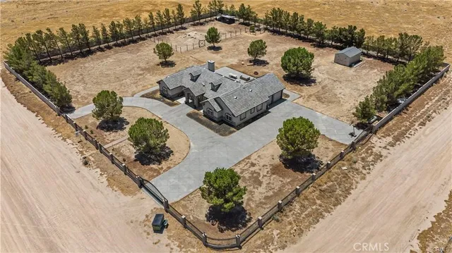 an aerial view of house with yard