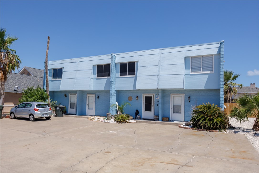 15432 Salt Cay Court, Unit 101 Corpus Christi, TX 78418 - Photo 1 of 37 a view of a car parked in front of building