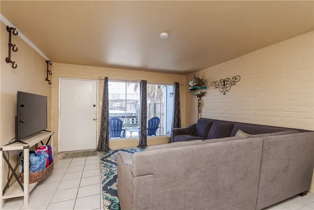 a bedroom with a bed and flat screen tv