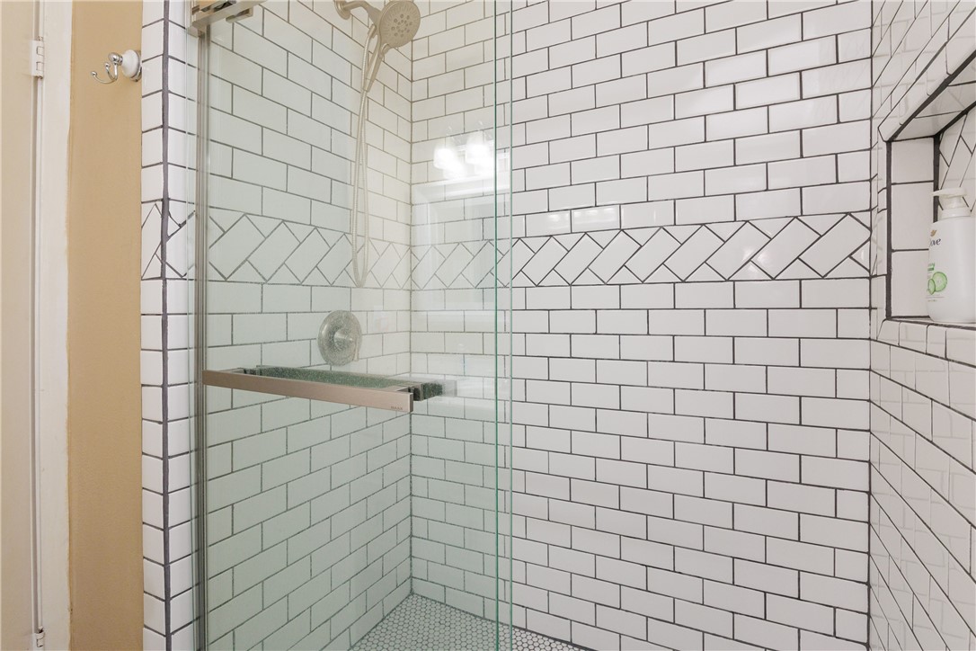 15432 Salt Cay Court, Unit 101 Corpus Christi, TX 78418 - Photo 19 of 37 a bathroom with a shower