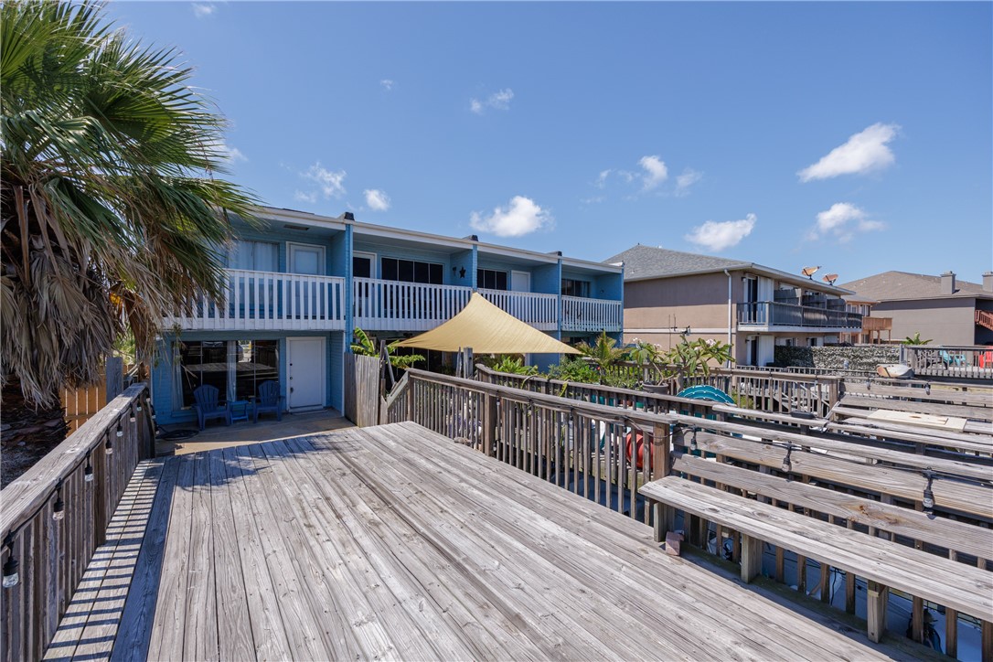 15432 Salt Cay Court, Unit 101 Corpus Christi, TX 78418 - Photo 29 of 37 a view of backyard with deck and wooden floor