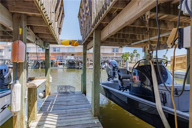 a view of a chairs and table on the balcony