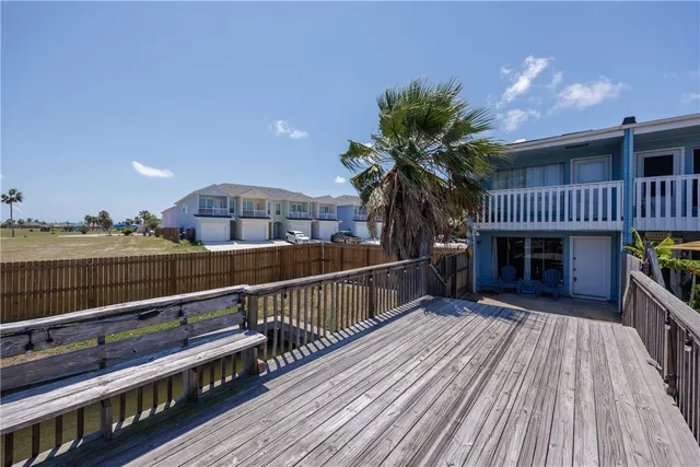 a view of balcony with deck and wooden floor