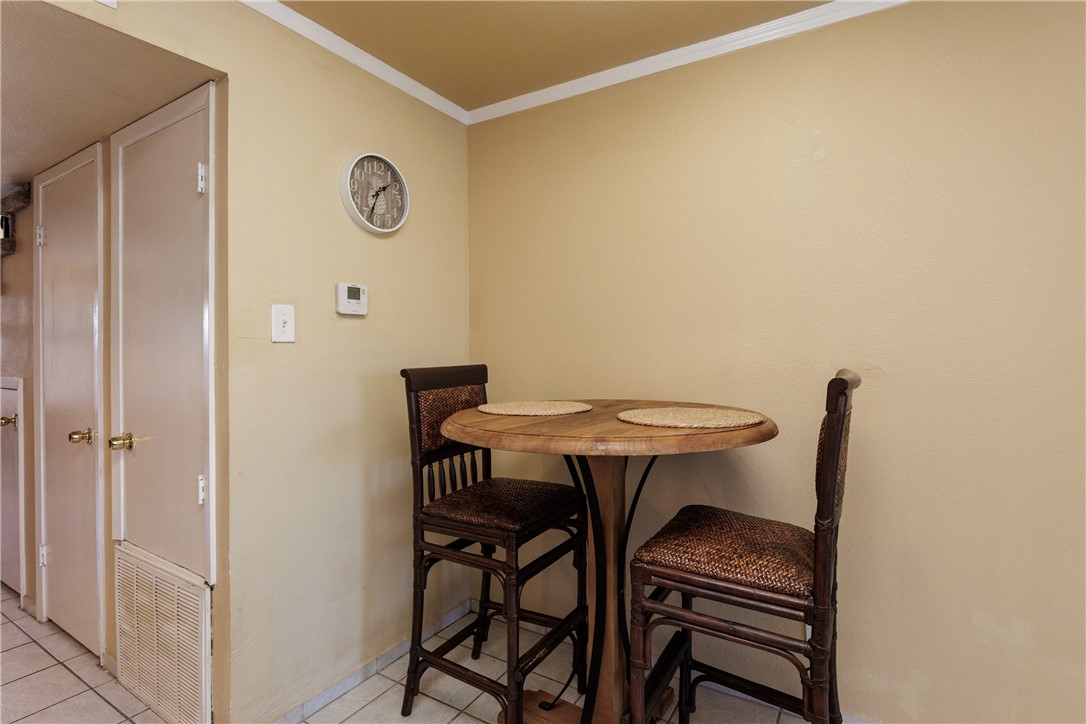 15432 Salt Cay Court, Unit 101 Corpus Christi, TX 78418 - Photo 8 of 37 a view of a room with a table and chairs